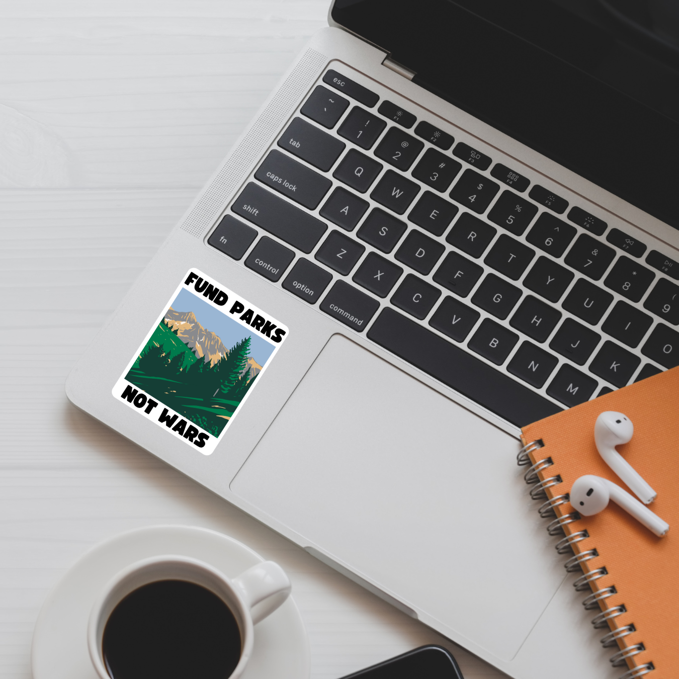 anti-war sticker, national parks sticker, progressive decal, fund parks not bombs, peace sticker, environmental activism, anti-military budget, leftist politics, water-resistant sticker, scenic protest sticker, nature over conflict, anti-imperialist sticker, public lands supporter, protest art sticker